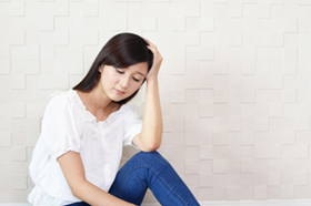 不調の女性